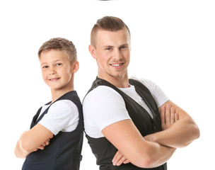 Portrait of happy father and son on white background