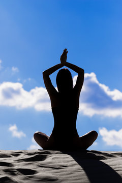 Yoga on a sandy hill