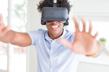 African amaerican man having fun playing with virtual reality glasses