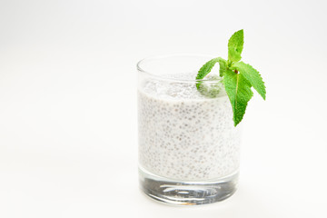 Chia pudding with mint on a white background. Space for text or design.