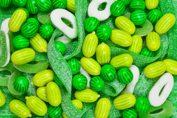 Assorted green gummy candies background. Top view. Jelly  sweets.