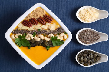 Pumpkin smoothie in a white bowl.