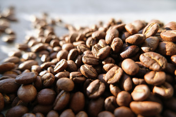 Aroma background made of coffee beans on sun light with copyspace. Beverages, morning and cafe concept