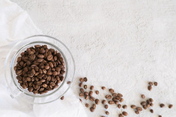 Aroma frame fot text made of glass cup coffee beans on gray background with copyspace. Flat lay,...