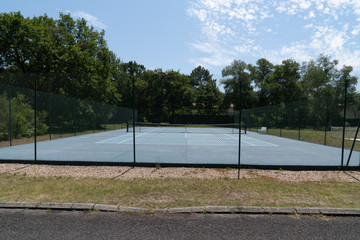 outdoor empty tennis court blue and green