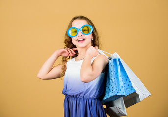 Nice purchase. happy shopping girl with bags. summer sales. Small girl fashion. cyber Monday. Present and gifts buy. black Friday discount. happy birthday holiday. Beauty. Own business