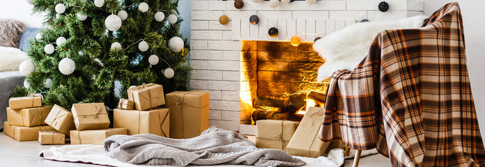 Fireplace and Christmas tree with presents in living room