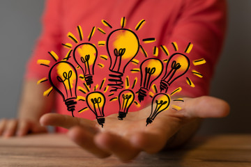  touching light bulbs, new ideas with innovative technology and creativity.