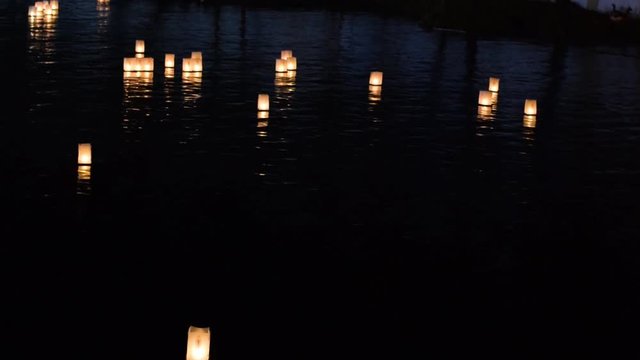Floating fire lamps in Tomar river
