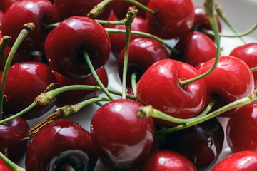close-up of tasty and sweet organic farm cherries, background, top view. farm berries bring many benefits to the human body.