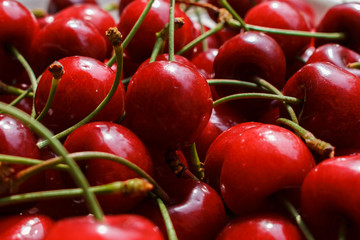 tasty and sweet organic farm cherries, background, side view. large collection of fresh organic red cherries. Ripe cherries background..