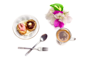 Two cakes and a cup of coffee