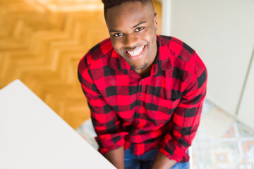 Obraz premium Handsome african young man smiling confident with big smile on face