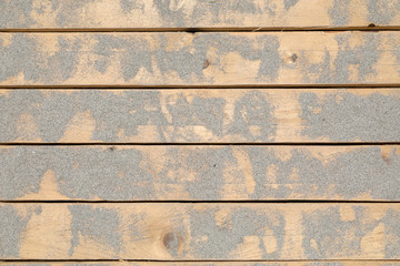 Tavole di legno sporche di sabbia