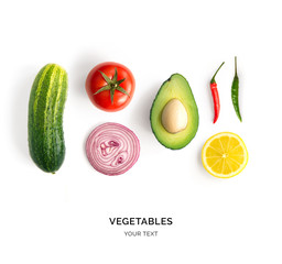 Creative layout made of avocado, onion, tomatoes, pepper and lemon. Flat lay. Food concept....