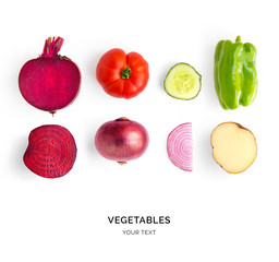 Creative layout made of beetroot, green pepper, cucumber, tomato, onion and potato. Flat lay. Food...