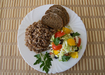 Buckwheat salad with cabbage,  peppers, black olives