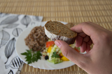 Fototapeta premium Buckwheat salad with cabbage, peppers, black olives