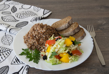 Buckwheat salad with cabbage,  peppers, black olives