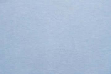 Light blue linen pastel fabric, background or texture, closeup, top view, horizontal