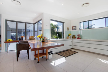 Modern kitchen with a table and ch