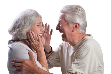Happy beautiful senior couple posing on white background