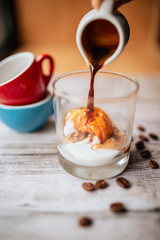 Ice cream with coffee on wooden background 