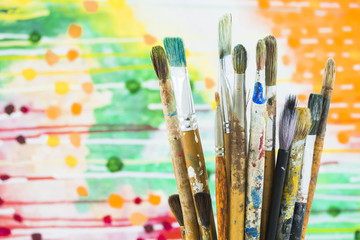 Obraz premium Group of brushes on colorful background