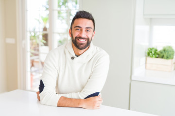 Handsome man smiling cheerful with a big smile on face showing teeth, positive and happy expression