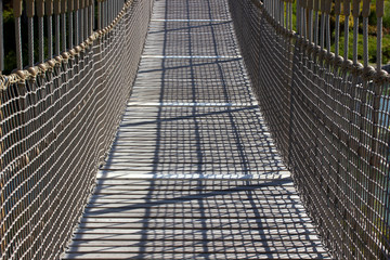 wooden suspension bridge in public park