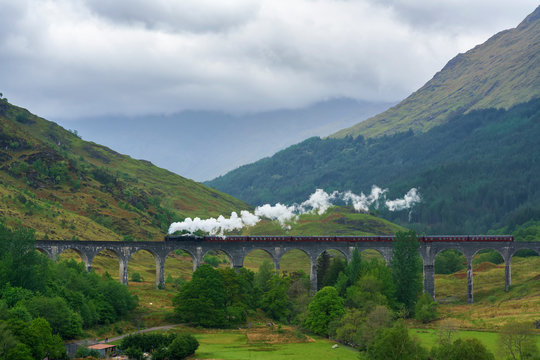 Steam train on the Glenfinnan Viaduct so called Harry Potter bridge located at the top of Loch Shiel in the West Highlands of Scotland