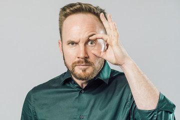 Funny handsome young man with surprised face expression