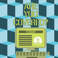 Fototapeta premium Conceptual hand writing showing Are You Covered Question. Business photo showcasing asking showing if they had insurance in work or life Computer Mounted on Stand with Online Profile Data on Screen.
