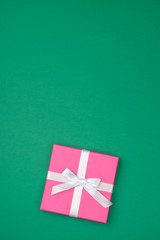 Gift box over colored backrgound with copy space