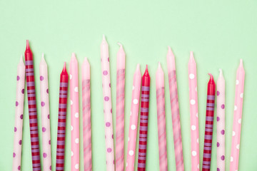 Birthday candles on colorful background. Flat lay