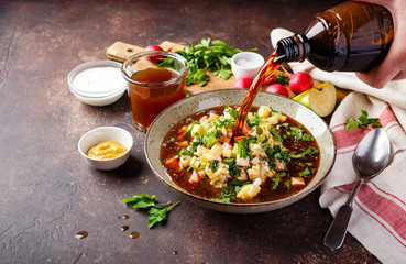 Cold Soup Okroshka with sausage, vegetables and kvass