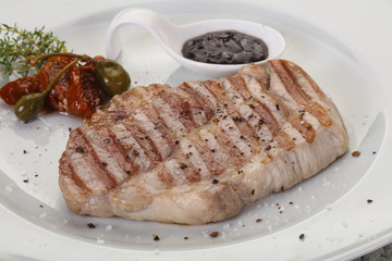Grilled pork steak with pepper sauce