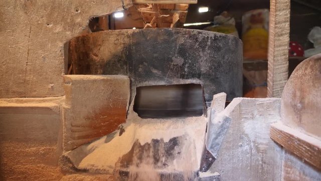 Interior of watermill. Grinding Grain into Flour at the Old Stone Mill