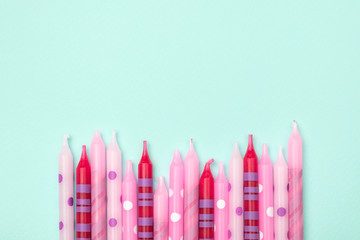 Birthday candles on colorful background. Flat lay