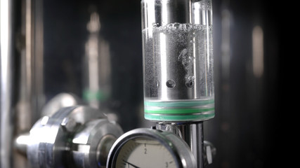 Small Glass Cylinder with Colorless Liquid