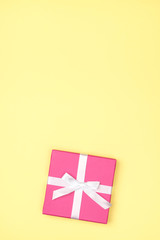 Gift box over colored backrgound with copy space