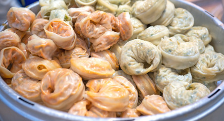 Delicious steamed round shaped dumplings in South Korea traditional market, special korean street food cuisine, close up, bokeh, copy space