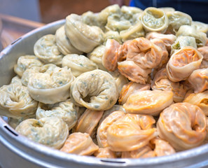 Delicious steamed round shaped dumplings in South Korea traditional market, special korean street food cuisine, close up, bokeh, copy space
