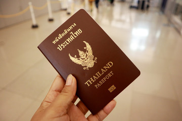 Tourism woman international holds a Thailand passport ready to boarding, Kansai International Airport