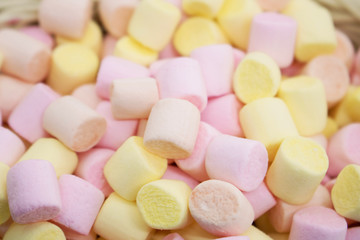 Marmellow air marshmallow close-up on a pink background, pastel colors, light dessert, place for text