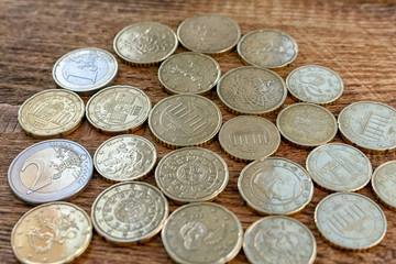 coins euro pile pack heap on a wooden background with space for an inscription mock up selective focus close up