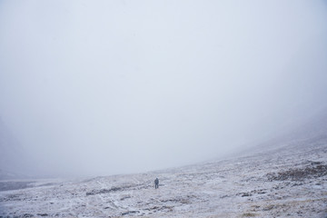 Fototapeta na wymiar Standing in the Mountain plains in snow