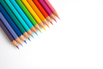 Photo of many color pencils on white background. Various colors. Advertising, blog post, newsletters.