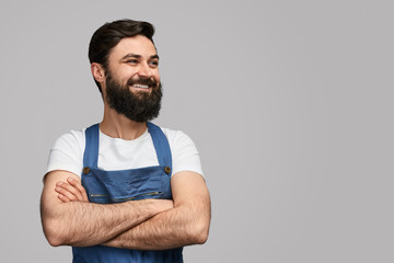 Confident mechanic looking at empty space