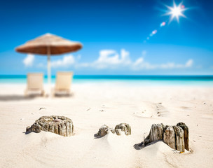 Obraz premium Summer background of beach with yellow sand and umbrella 